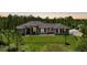 Beautiful single-story home with metal roof, set on a sprawling lot with lush landscaping at 8312 Acorn Blvd, Punta Gorda, FL 33982