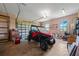 Spacious garage with ample storage and a four wheeler, perfect for housing vehicles and recreational equipment at 8312 Acorn Blvd, Punta Gorda, FL 33982