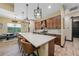 Spacious kitchen featuring wood cabinets, a large island, and modern lighting fixtures at 8312 Acorn Blvd, Punta Gorda, FL 33982