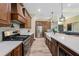 Modern kitchen showcasing stainless steel appliances, granite countertops, and wood flooring at 8312 Acorn Blvd, Punta Gorda, FL 33982