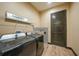 Laundry room featuring a washer, dryer, decorative backsplash, and wire shelving at 8312 Acorn Blvd, Punta Gorda, FL 33982