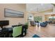 Inviting living room featuring a fireplace, a ceiling fan, and comfortable seating with great natural light at 8312 Acorn Blvd, Punta Gorda, FL 33982