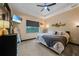 Inviting main bedroom with a ceiling fan, cozy decor, and abundant natural light at 8312 Acorn Blvd, Punta Gorda, FL 33982