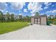 Storage shed in backyard with convenient gravel access, perfect for storing tools and equipment at 8312 Acorn Blvd, Punta Gorda, FL 33982
