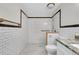 Spacious bathroom with white subway tile and large accessible shower at 875 Bayshore Dr, Englewood, FL 34223