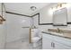 Spacious bathroom with white subway tile and large accessible shower at 875 Bayshore Dr, Englewood, FL 34223