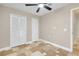 Bedroom featuring neutral colors, two closets, and a modern ceiling fan at 875 Bayshore Dr, Englewood, FL 34223