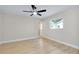 Bedroom features modern ceiling fan and a view of the outside from the window at 875 Bayshore Dr, Englewood, FL 34223
