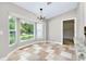 This bright dining area features large windows offering great outdoor views at 875 Bayshore Dr, Englewood, FL 34223