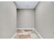 A small hallway features neutral paint colors and neutral toned tile floor at 875 Bayshore Dr, Englewood, FL 34223