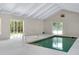 Indoor pool with bright lighting and ample space for recreational activities at 875 Bayshore Dr, Englewood, FL 34223