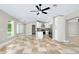 Bright, open kitchen area with white cabinets and modern appliances, part of the open living space at 875 Bayshore Dr, Englewood, FL 34223