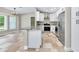 Modern kitchen features white cabinetry, granite countertops, and stainless steel appliances at 875 Bayshore Dr, Englewood, FL 34223