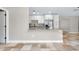 Kitchen view featuring white cabinets, granite countertops, stainless steel appliances and tile flooring at 875 Bayshore Dr, Englewood, FL 34223