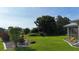 A sprawling backyard with lush greenery and tastefully landscaped garden beds that enhance the natural beauty at 96 Mocha Ct, Punta Gorda, FL 33983