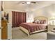Cozy bedroom features a Queen bed with decorative pillows, ensuite bathroom, and ample closet space at 96 Mocha Ct, Punta Gorda, FL 33983