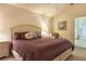 Comfortable bedroom features a queen-sized bed with warm lighting and stylish decor at 96 Mocha Ct, Punta Gorda, FL 33983