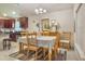 Dining area features a table set for four with a chandelier above and views to the kitchen at 96 Mocha Ct, Punta Gorda, FL 33983