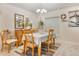 Charming dining room features table set for four and a view to the decor at 96 Mocha Ct, Punta Gorda, FL 33983