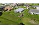 Exterior shot featuring a meticulously maintained lawn with landscaped gardens surrounding the property at 96 Mocha Ct, Punta Gorda, FL 33983