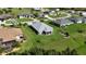 An exterior shot showcases a charming property surrounded by well-maintained lawns in a serene neighborhood at 96 Mocha Ct, Punta Gorda, FL 33983