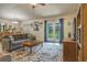 Inviting living room with large French doors, open to the dining area, and stylish décor at 96 Mocha Ct, Punta Gorda, FL 33983