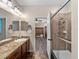Bathroom featuring modern glass shower, tiled floors, and granite topped vanity at 10131 Winding River Rd, Punta Gorda, FL 33950
