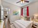 Comfortable bedroom featuring a bed with stylish lighting and an ensuite bathroom access at 10131 Winding River Rd, Punta Gorda, FL 33950
