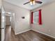 Bedroom with modern ceiling fan, wood-look floors, and natural light at 10131 Winding River Rd, Punta Gorda, FL 33950