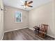 Cozy bedroom with ceiling fan and natural light from a window at 10131 Winding River Rd, Punta Gorda, FL 33950