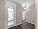 Inviting foyer with a glass front door and neutral color palette at 10131 Winding River Rd, Punta Gorda, FL 33950