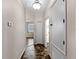 Hallway featuring a decorative tile floor and neutral walls with views into other rooms at 10131 Winding River Rd, Punta Gorda, FL 33950