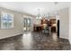 Bright kitchen featuring dark wood cabinetry, granite countertops and access to an outdoor pool area at 10131 Winding River Rd, Punta Gorda, FL 33950