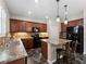 Kitchen featuring a stone countertops, wooden cabinets, and stainless steel appliances at 10131 Winding River Rd, Punta Gorda, FL 33950