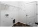 Simple laundry room with white walls and access to the outdoors at 10131 Winding River Rd, Punta Gorda, FL 33950