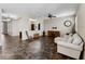Inviting living room featuring a comfortable sofa, a wooden rocking chair, and an open view to the adjacent office at 10131 Winding River Rd, Punta Gorda, FL 33950
