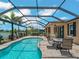 Screened pool with beautiful lake view, perfect for relaxing and enjoying the Florida lifestyle at 10131 Winding River Rd, Punta Gorda, FL 33950