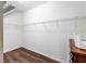 Walk-in closet features built-in shelving and hardwood floors at 10131 Winding River Rd, Punta Gorda, FL 33950