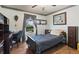 Cozy bedroom featuring wood floors, a single bed, charming wall decorations and a view of the pool at 11068 Jacqueline Ave, Englewood, FL 34224