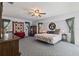 Spacious bedroom with neutral walls, carpet floors, and decorative wall hangings at 11068 Jacqueline Ave, Englewood, FL 34224