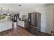 Open kitchen featuring stainless steel appliances, tile flooring, and modern finishes at 11068 Jacqueline Ave, Englewood, FL 34224