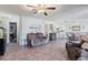 Open concept living space with tile floors and open access to the kitchen and dining areas at 11068 Jacqueline Ave, Englewood, FL 34224