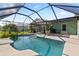 Screened-in pool featuring a spacious patio area, perfect for outdoor relaxation and entertainment in the backyard at 11068 Jacqueline Ave, Englewood, FL 34224