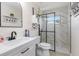 Modern bathroom showcasing a sleek glass shower, vanity with fixtures, and marble tile at 123 Annapolis Ln, Rotonda West, FL 33947