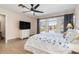 Spacious bedroom featuring ample light, hardwood floors, a ceiling fan, and modern decor at 123 Annapolis Ln, Rotonda West, FL 33947