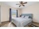 Comfortable bedroom with neutral walls, wood-look floors, and a cozy bed at 123 Annapolis Ln, Rotonda West, FL 33947