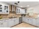 The kitchen is complete with stainless steel appliances, custom cabinetry, granite counters, and tile backsplash at 123 Annapolis Ln, Rotonda West, FL 33947