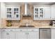 Kitchen featuring granite countertops, stainless steel appliances, custom cabinetry and tile backsplash at 123 Annapolis Ln, Rotonda West, FL 33947