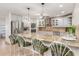 The kitchen has stainless steel appliances, a center island, and barstool seating for entertainment at 123 Annapolis Ln, Rotonda West, FL 33947