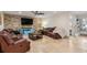 Stylish living area with tile flooring, comfortable seating, and contemporary decor create a warm atmosphere at 123 Annapolis Ln, Rotonda West, FL 33947
